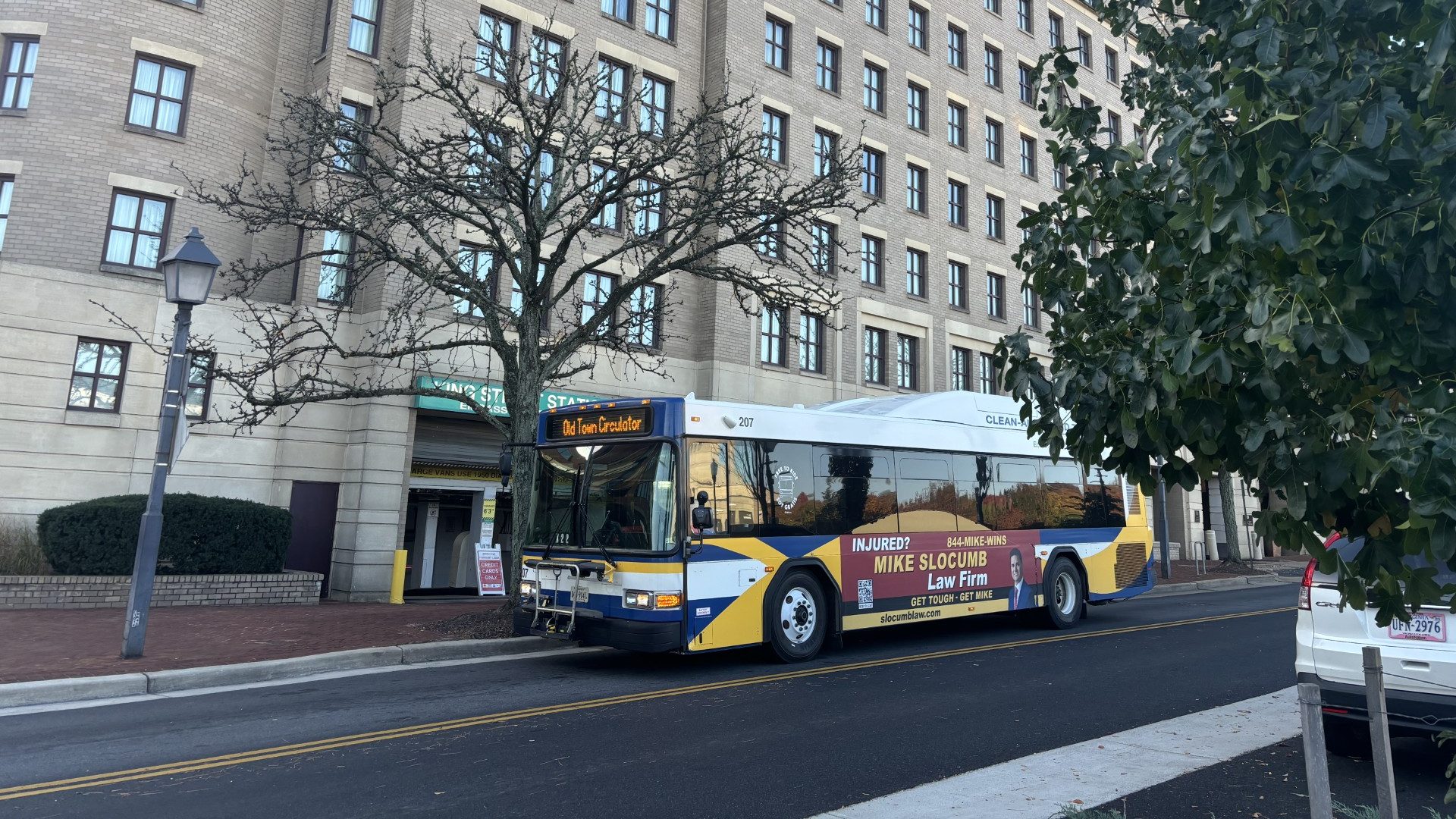 A photo of a DASH bus with an advertisement on the side.