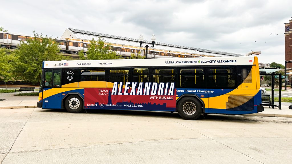 A DASH bus with a wrap design that says "Alexandria" in large white letters